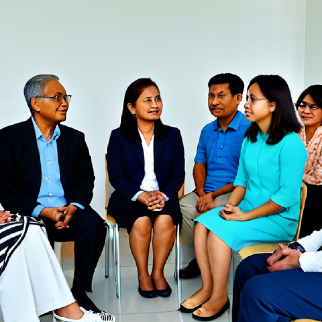 회복적 정의에서의 피해자와 가해자의 역할 - **Community Mediation:** A diverse group of Malaysians (Malay, Chinese, Indian) are seated in a brig...